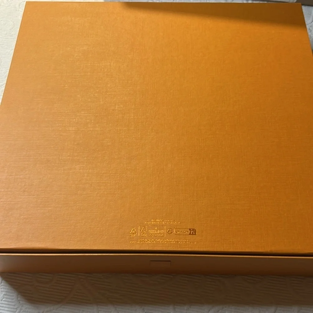 Louis Vuitton Signature  Box inside a LV shipping box with tissue and ribbon.